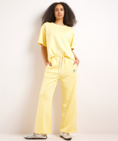 wijde scuba broek met label