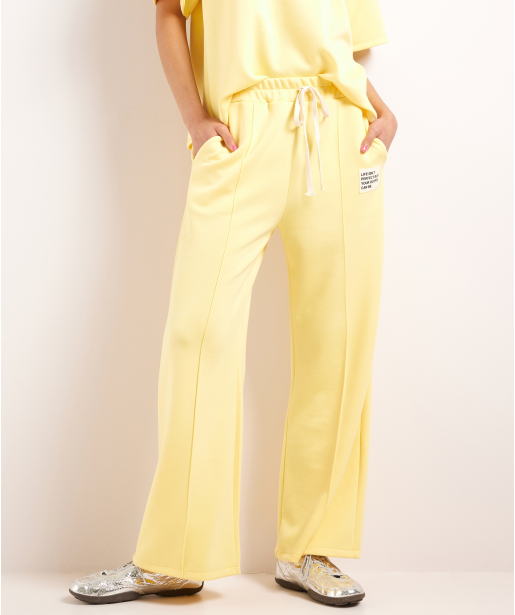 wijde scuba broek met label