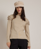 trui met ruches en knopen