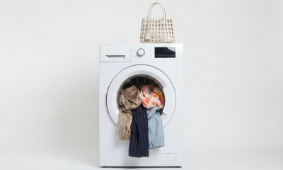 wasmachine met nieuwe kleding erin